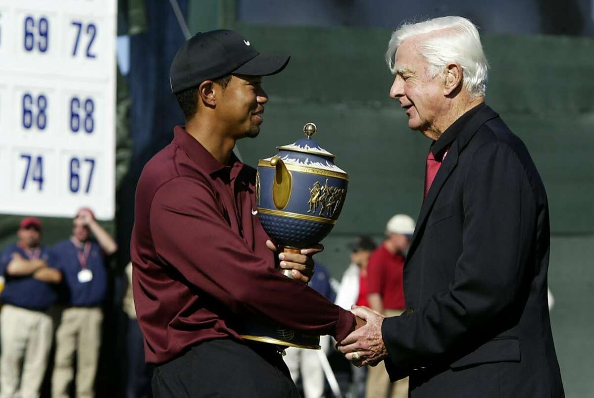 AMEXgolf_0039_db.jpg Tiger Woods shakes hands with Sandy Tatum (Honorary Chairman) as he holds the trophy after winning the American Express Championship at Harding Park Golf Course. Event on 10/9/05 in San Francisco. Darryl Bush / The Chronicle Ran on: 06-11-2006 Sandy Tatum (right), with Tiger Woods after 2005 American Express Championship, defended Winged Foots difficulty in 1974. Ran on: 06-11-2006 Sandy Tatum (right), with Tiger Woods after 2005 American Express Championship, defended Winged Foots difficulty in 1974. Ran on: 06-11-2006