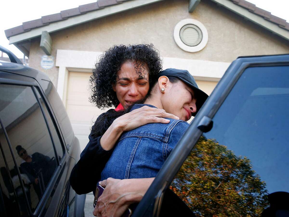 Sandra Salazar hugs her oldest daughter Citlalli after the family moved out of their home in Fairfield, Calif. on Wednesday, June 14, 2017. Salazar and one of her three daughters are relocating to Mexico to live with her husband and the daughters' father who lost his U.S. immigration status and forced to return to his home country while Salazar's oldest daughter Citlalli will remain in California.
