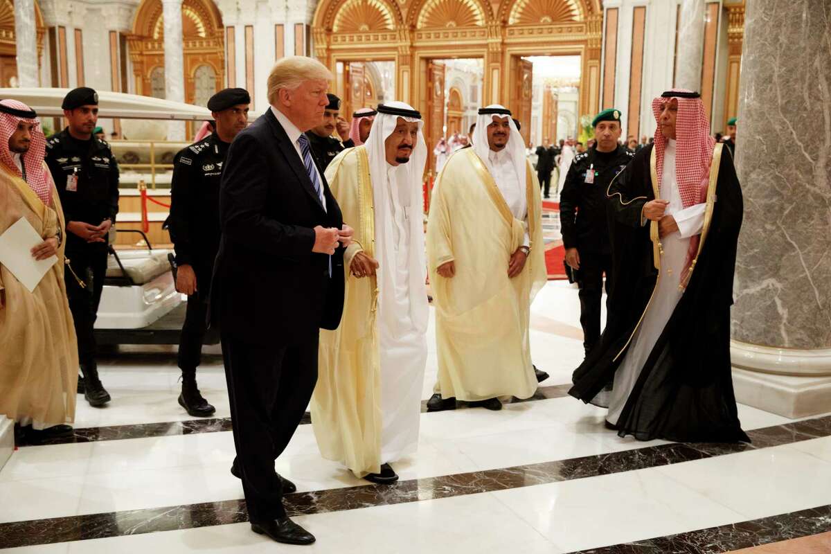 President Donald Trump and Saudi King Salman, center left, arrive to the Arab Islamic American Summit, at the King Abdulaziz Conference Center, Sunday, May 21, 2017, in Riyadh, Saudi Arabia. (AP Photo/Evan Vucci)