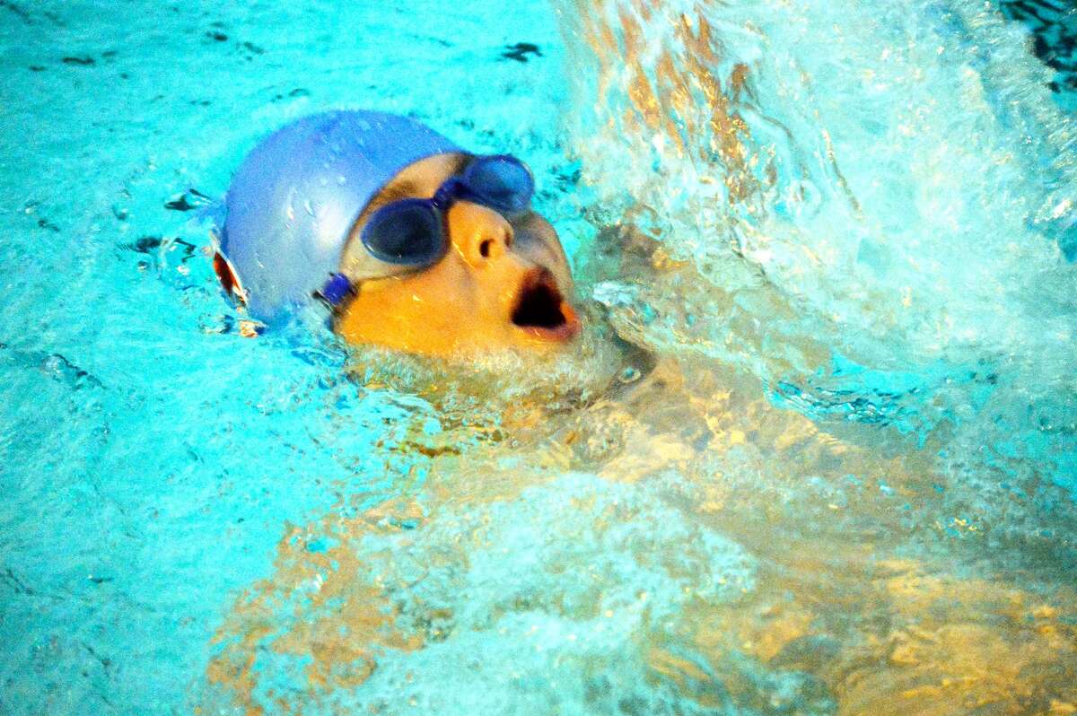 Water Works swimmer Gabe Csaszar competes in the 25-meter backstroke for the 7-8 boys division.