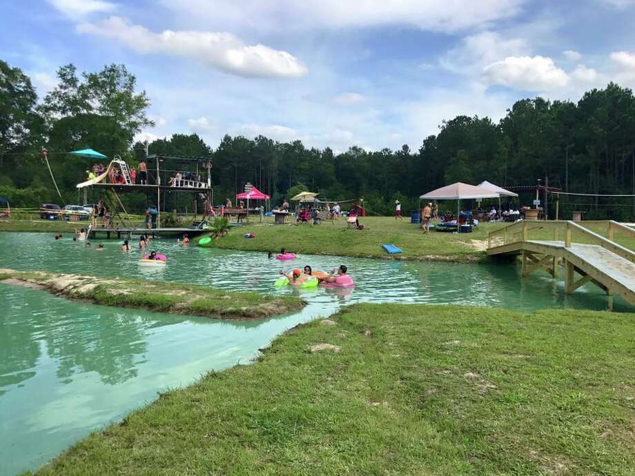 Conroe 'backyard' waterpark turns a swimming hole into a country resort ...