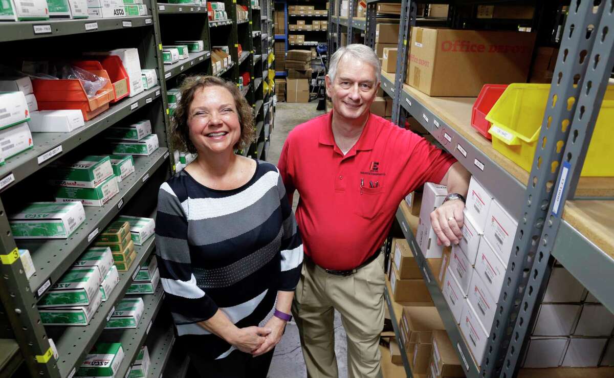 Carole Cook, CEO, and Larry Davis, president, in the warehouse of Industrial Equipment Company in Houston, TX, June 21, 2017. (Michael Wyke / For the Chronicle)