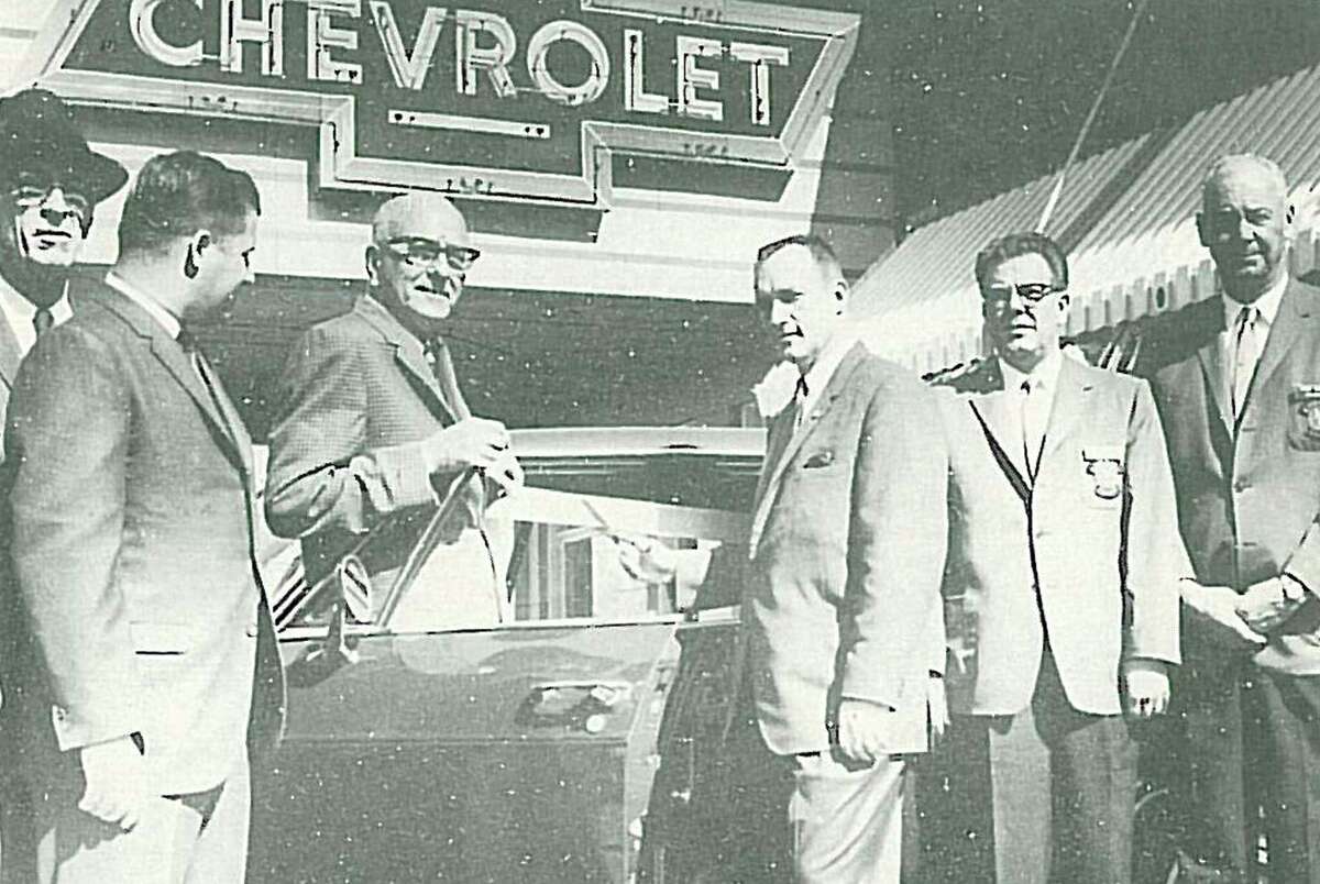A ribbon cutting at Weisinger-Buckalew Chevrolet in January 1965. Pictured left to right are J.D. Weisinger, Ken Hineman, W.B. Weisinger, Don A. Buckalew, Glen McClellen and Frank Zachry (Embassy Club Members.)