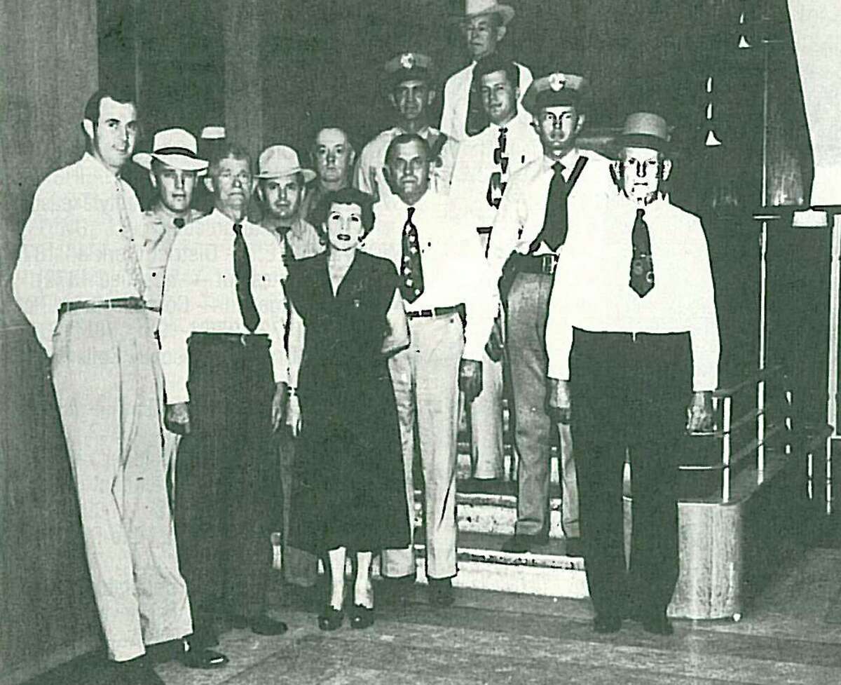 Pictured are Sheriff Fannie Pearl Surratt, center, and her officers in 1949. First row left to right, Bill DeArmond; E.L. McDuffie, Ed Damuth; Second row: Jimmy Casper, Le Roy Beavers, Fred Bull Sr.; Third row: Joe White, Fred Bull; Fourth row: Pete Telford, Hollis Bowden; fifth row: Les Doughtie.