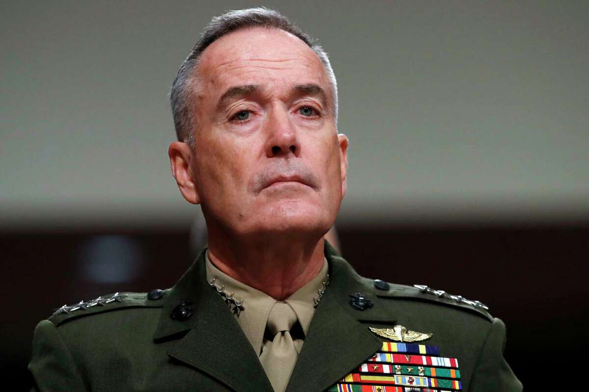 FILE - In this June 13, 2017, file photo. Joint Chiefs Chairman Gen. Joseph Dunford listens on Capitol Hill in Washington. Military chiefs will seek a six-month delay before letting transgender people enlist in their services, officials said June 23. Dunford told a Senate committee there have been some issues identified with recruiting transgender individuals that Â?“some of the service chiefs believe need to be resolved before we move forward.Â?” He said Mattis was reviewing the matter. (AP Photo/Jacquelyn Martin, File)
