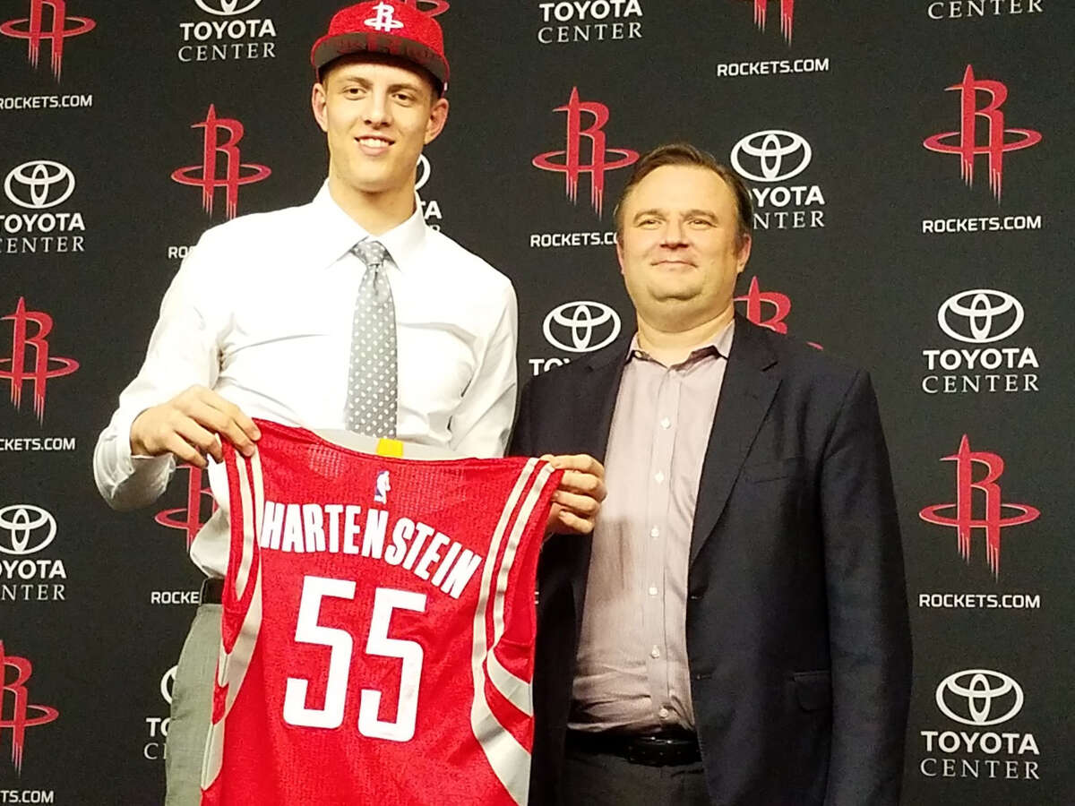 The Rockets used their first pick of Thursday's draft, No. 43 overall, on Isaiah Hartenstein, who averaged 20.2 points and 12 rebounds last season playing in a Lithuanian league. General manager Daryl Morey, right, said the 7-footer will remain overseas to play professionally next season.