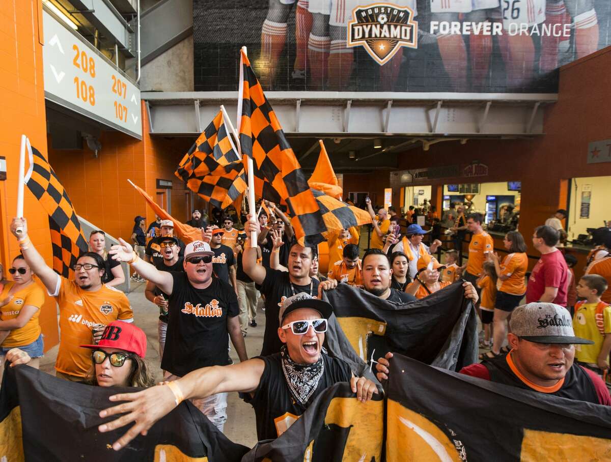 Houston Dynamo fans march into the stadium before the MLS soccer game between the Dynamo and FC Dallas at BBVA Compass Stadium on Friday, June 23, 2017, in Houston. ( Brett Coomer / Houston Chronicle )