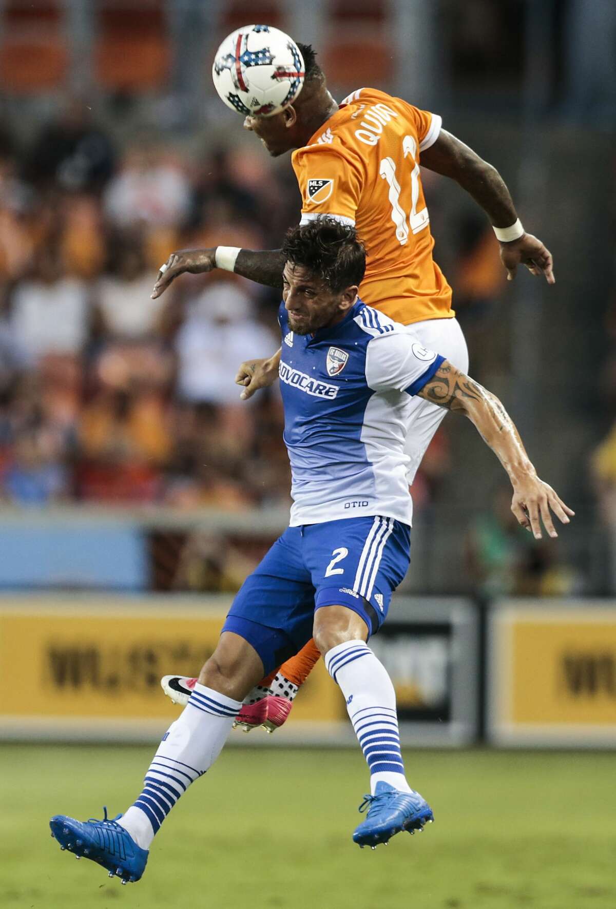 Houston Dynamo forward Romell Quioto (12) and FC Dallas defender Hernan Grana (2) go after the ball during the first half of an MLS soccer game Friday, June 23, 2017, in Houston. (Brett Coomer/Houston Chronicle via AP)