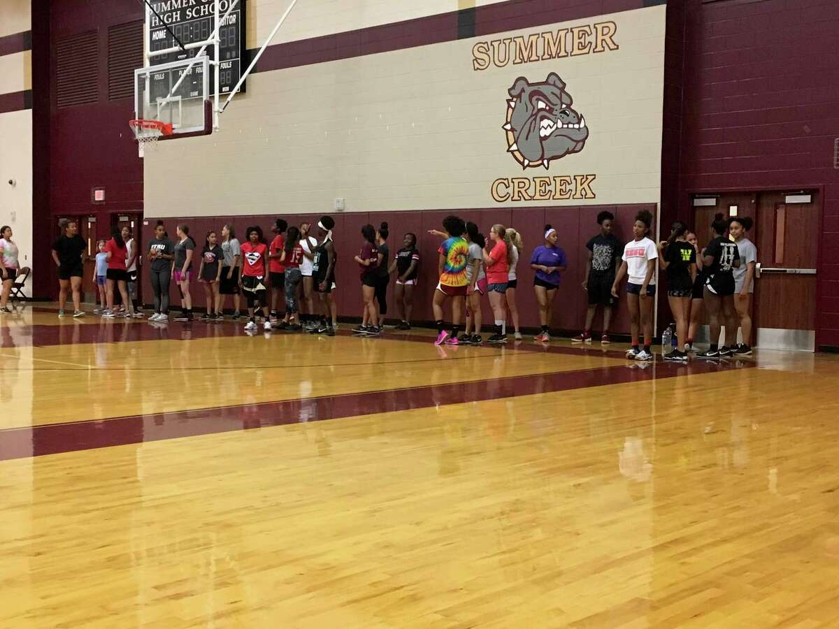 Girls line up in the gym for warmup exercises at the Summer Creek Lady Bulldogs Speed and Strength Camp on June 21.