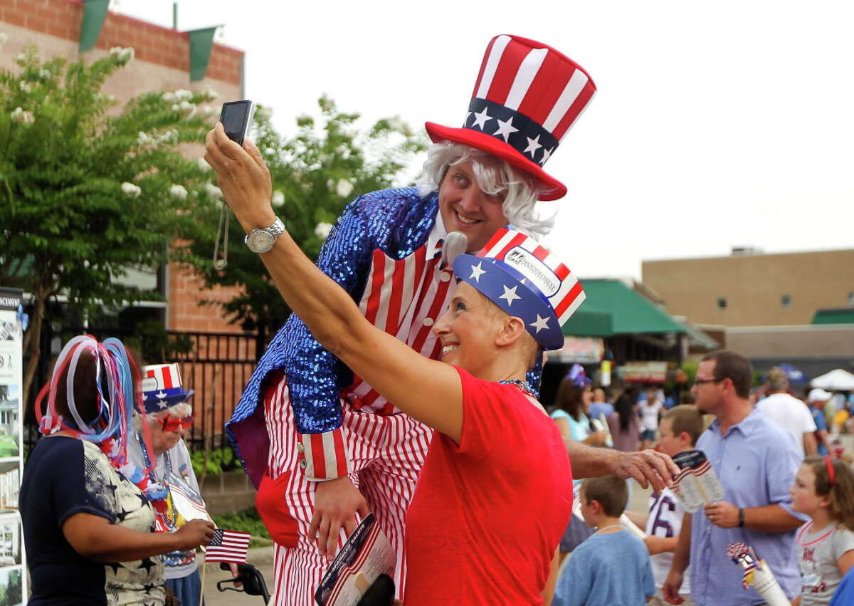 In this file image from July 4, 2015, Denise Aoun, right, takes a selfie with Ryan Magnuson before the Star Spangled Salute at The Cynthia Woods Mitchell Pavilion Friday. More than 11,000 visitors enjoyed music from the Houston Symphony during the annual event.