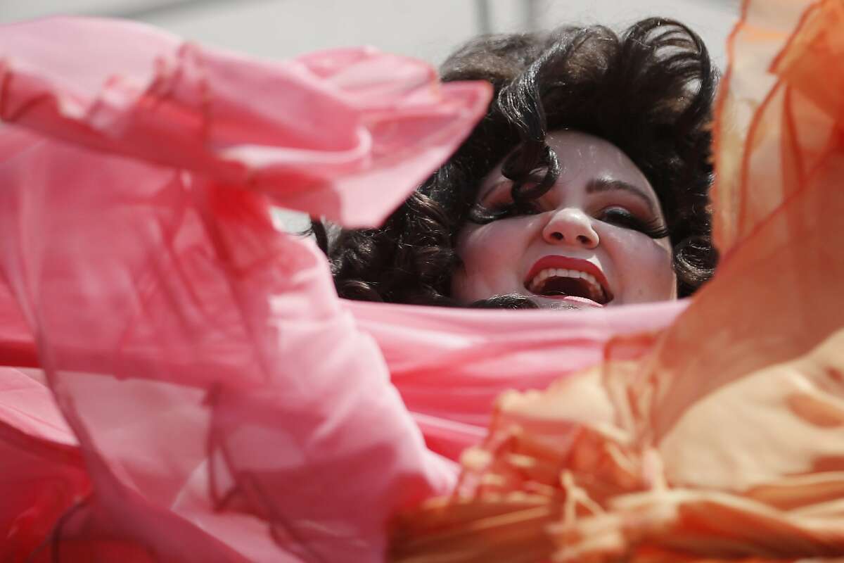 Kitty Von Quim of the Red Hots Burlesque performs during the 25th annual Dyke March at Dolores Park on Saturday, June 24, 2017, in San Francisco, Calif.