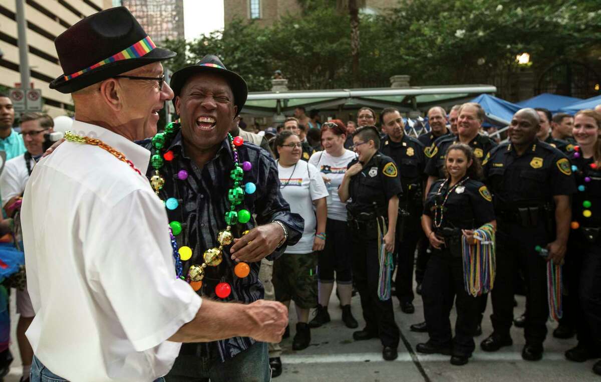 Houston Mayor Syvester Turner laughs with Sen. John Whitmire during the annual Pride Parade on Saturday, June 24, 2017, in Houston.