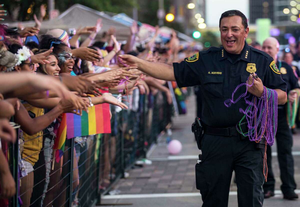 Houston Police Chief Art Acevedo hands out beads as he marches in the annual Pride Parade on Saturday, June 24, 2017, in Houston.