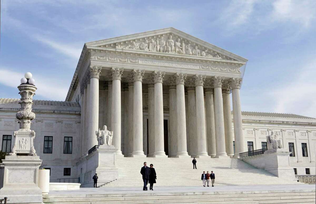 FILE - This Jan. 25, 2012, file photo, shows the U.S. Supreme Court Building in Washington. The Supreme Court enters its final week of work before a long summer hiatus with action expected on the Trump administration?’s travel ban and a decision due in a separation of church and state case that arises from a Missouri church playground. (AP Photo/J. Scott Applewhite, File) ORG XMIT: WX107
