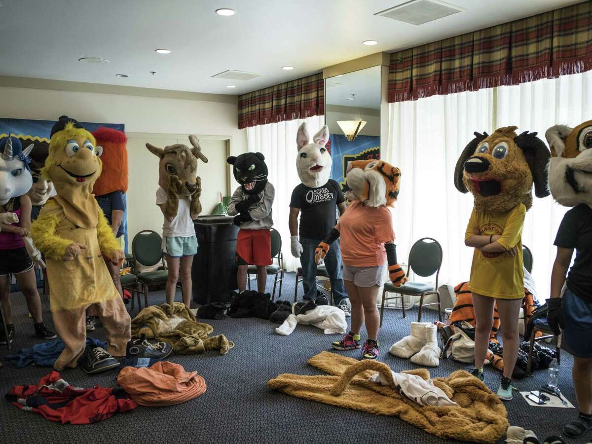 Mascots dress in their costumes during the Mascot training camp put on by Higher Impact Entertainment at the Crockett Hotel in San Antonio, TX on Saturday, June 24, 2017. The one-day camp that is in its sixth year, teaches mascots from middle school to the professional level how to care for their costumes, interact with fans and improve their skills. The workshop is directed by Higher Impact Entertainment director Jerome Bartlett, a former mascot for the Spurs organization as a backup Coyote, T-Bone for the Rampage, and was named the 2006 National Mascot Champion.
