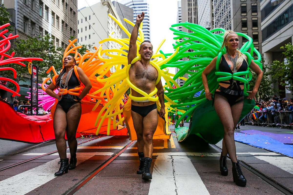 People in costume walk down Market Street during the Pride Parade in San Francisco, California, on Sunday, June 25, 2017.