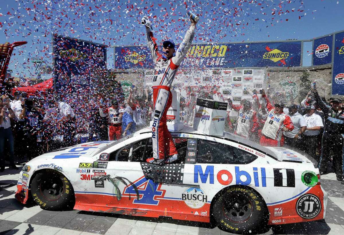Kevin Harvick celebrates after winning the NASCAR Sprint Cup Series auto race Sunday, June 25, 2017, in Sonoma, Calif. (AP Photo/Ben Margot)