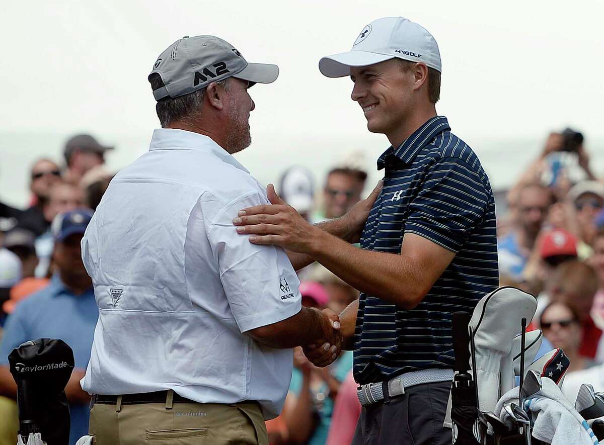 Jordan Spieth, right, greets Boo Weekley, left, on the first tee during the final round of the Travelers Championship golf tournament, Sunday, June 25, 2017, in Cromwell, Conn.