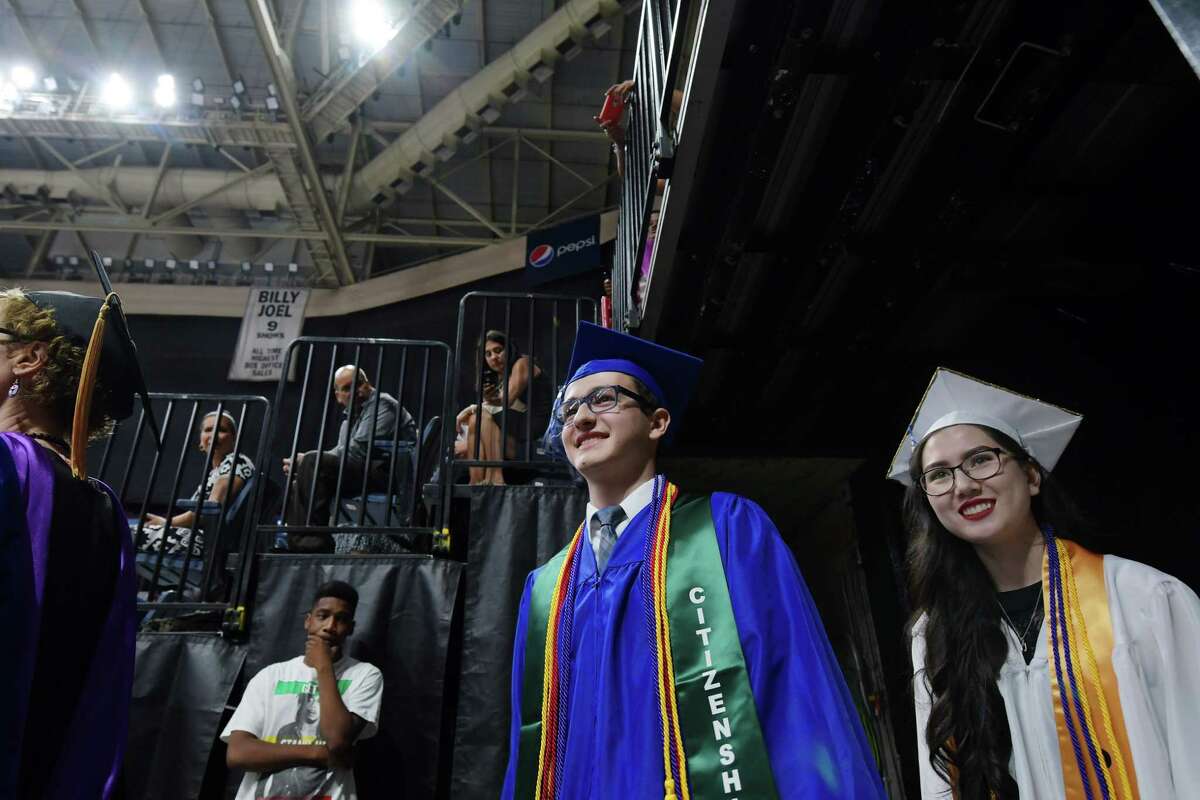 Albany High School valedictorian, Jacob Citone, left, and salutatorian, Emily Ha, get set to enter the main floor at the Times Union Center for the Albany High School graduation on Sunday, June 25, 2017, in Albany, N.Y. (Paul Buckowski / Times Union)
