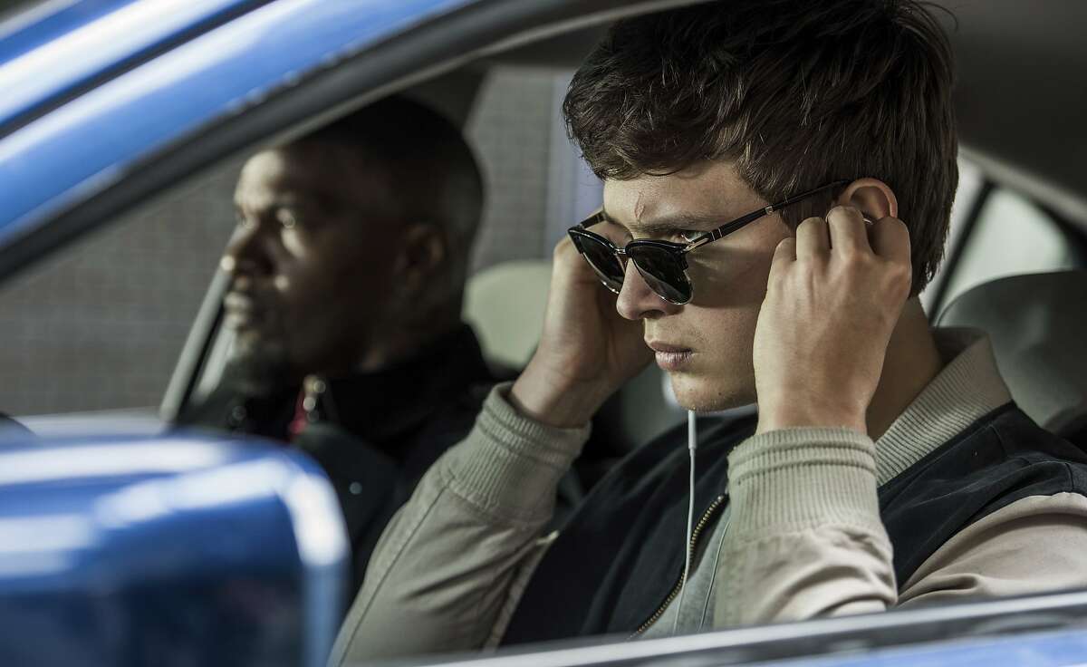 This image released by Sony Pictures shows Ansel Elgort, right, and Jamie Foxx in a scene from "Baby Driver." (Wilson Webb/Sony/TriStar Pictures via AP)