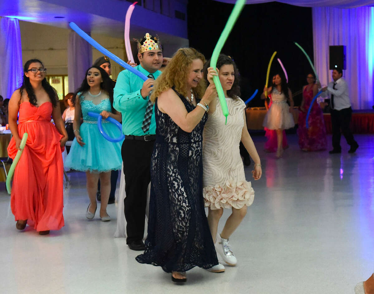 Special needs students from schools in Laredo dance with their escorts and chaperones on Friday, June 23, 2017 at the Laredo Civic Center during the Enchanted Evening Prom.