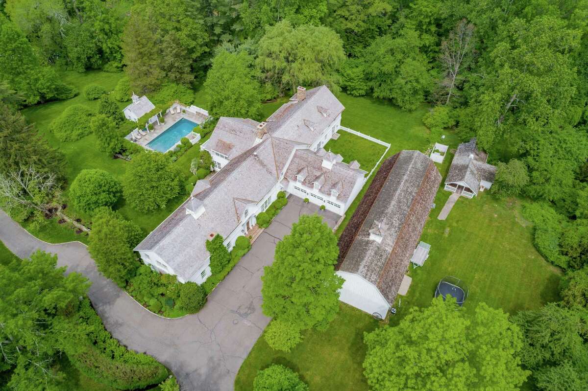 The converted and updated antique dairy barn in which Harry Connick Jr. and his wife Jill raised their three children sits on a 4.61-acre estate along with a second barn, a heated in-ground swimming pool, pool house, and guest cottage.