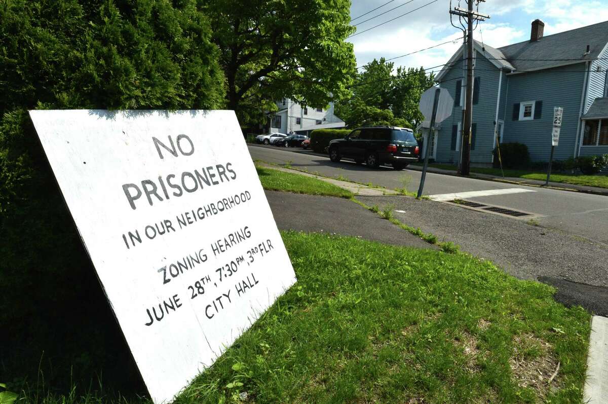 A sign on the property next to 17 Quintard Ave., the site of a proposed halfway house property owned by Firetree LLC. on Monday in Norwalk. The Norwalk Zoning Board of Appeals will hold a public hearing Wednesday on the owner’s request for a special exception to open the facility.