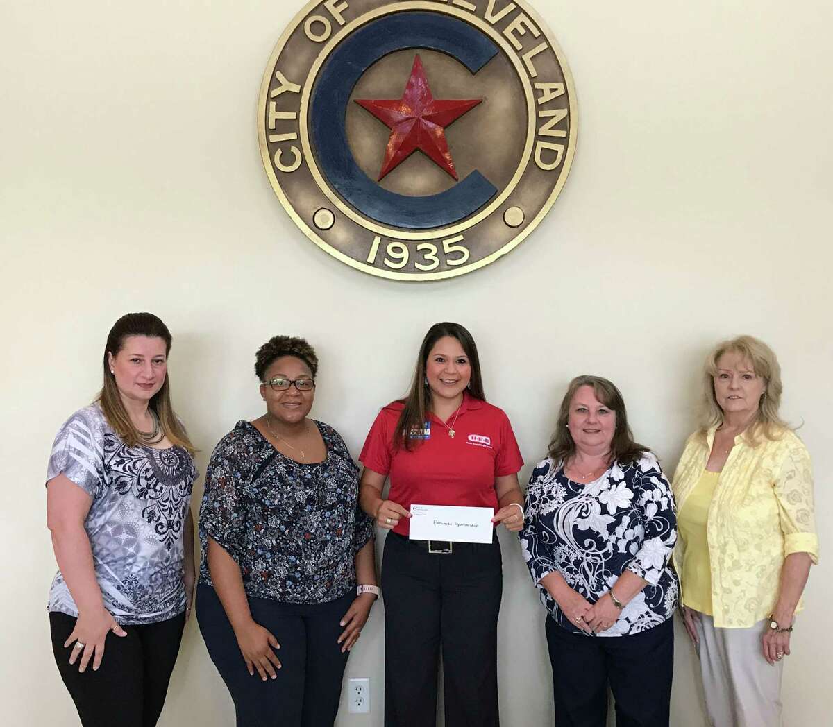 Dora Gallegos, manager of the H-E-B store in Cleveland, presents a donation to City of Cleveland staff for sponsorship of the Fourth of July Fireworks Show. H-E-B agreed to be a Star-Spangled sponsor, one of two, for the event. Pictured with Gallegos (center) is Civic Center staff Marina Ybanez and Ashleigh Broussard, City Manager Kelly McDonald and Mayor Pro Tem Carolyn McWaters.