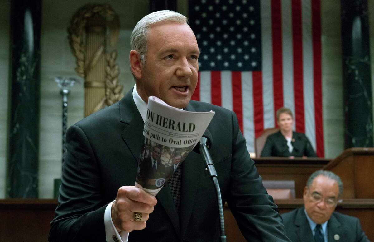 This image released by Netflix shows Kevin Spacey in a scene from "House Of Cards." Writing TV shows based on real life in Washington has always been a challenge. But since Donald Trump became president, writers of such series as Â?“Madam Secretary,Â?” Â?“House of CardsÂ?” and Â?“VeepÂ?” say their job is tougher than ever. The twists and turns of the Trump Administration keep the writers on their toes as they attempt to create their own make-believe plot twists that wonÂ?’t seem dull by comparison. (David Giesbrecht/Netflix via AP)