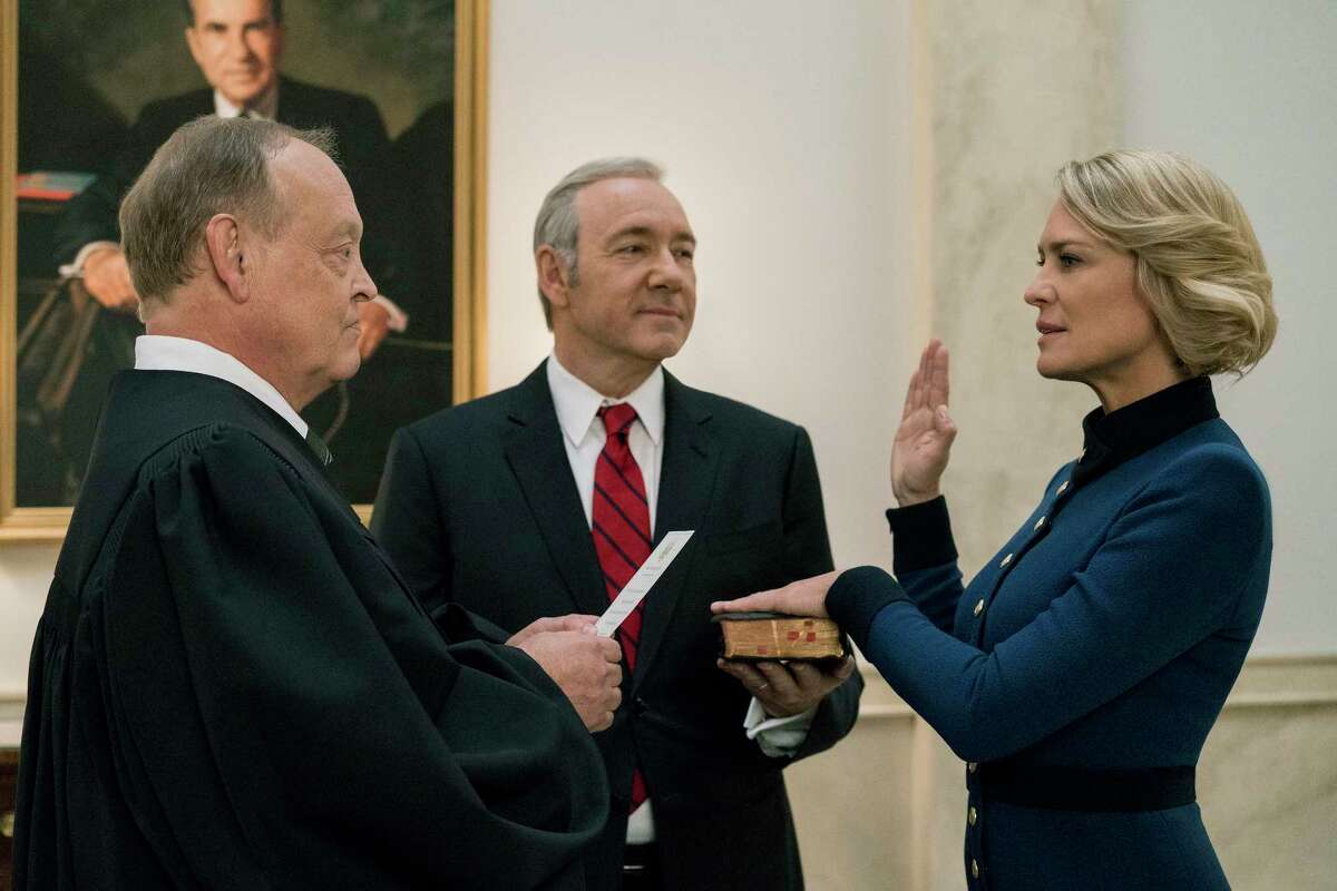 ﻿Kevin Spacey, center, and Robin Wright star as Frank and Claire Underwood in ﻿"House Of Cards."﻿