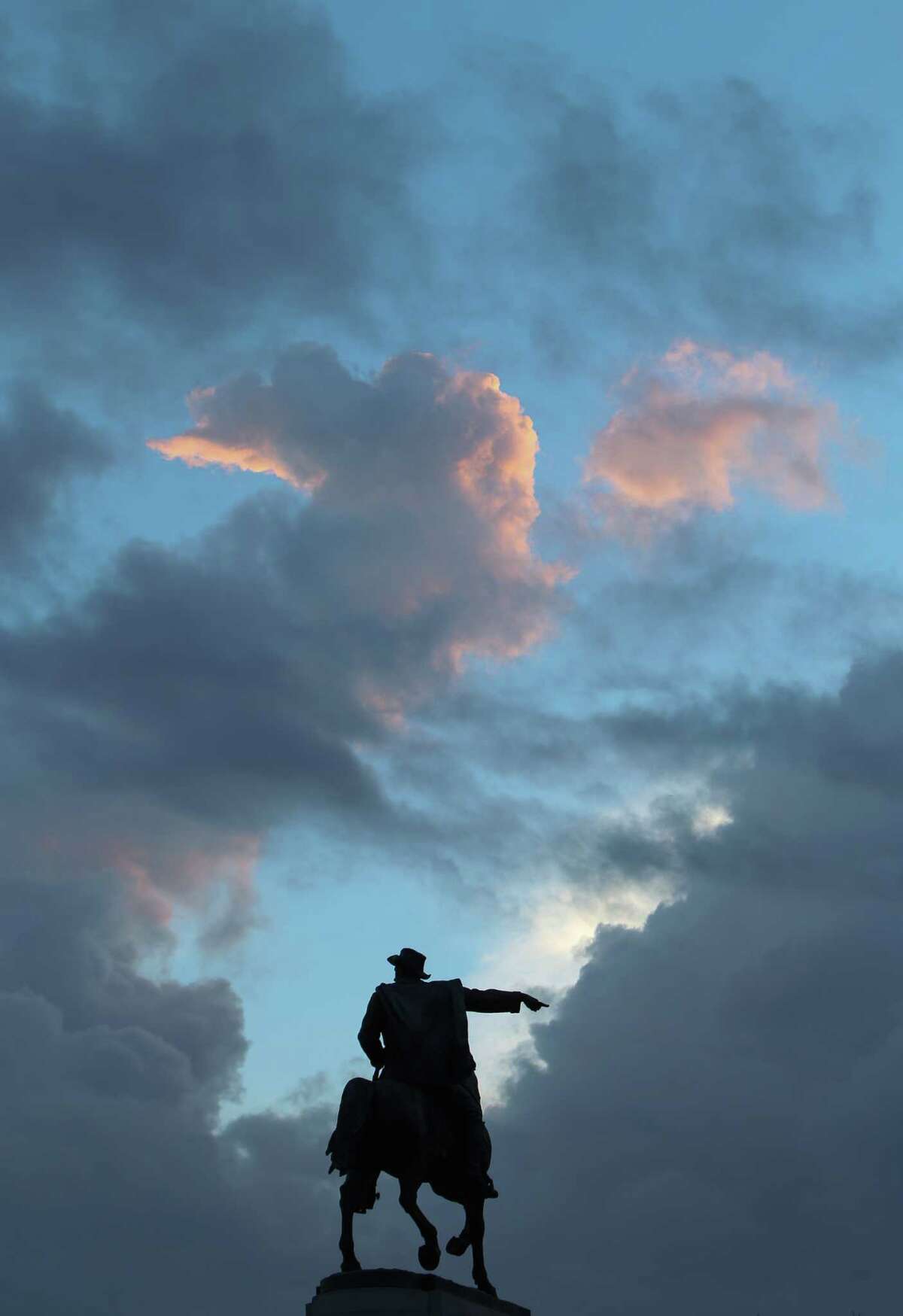 On the first day of fall, the statue of Gen. Sam Houston seems to point to a opening in the clouds before rain moved into the metro area Thursday, Sept. 22, 2016, in Houston. ( Steve Gonzales / Houston Chronicle )