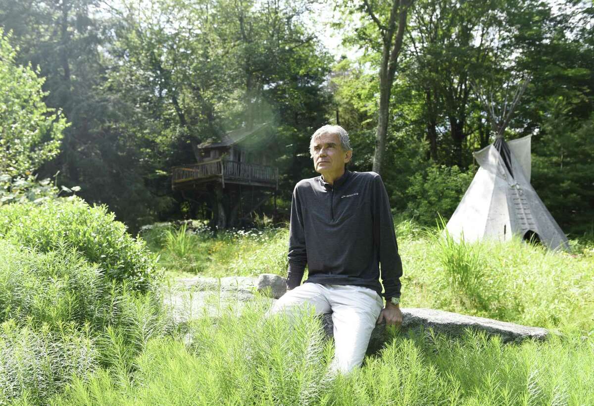 Scientist and explorer Luc Hardy poses outside his home in the Cos Cob section of Greenwich on Monday. Hardy has captained many climate change-themed scientific excursions and plans to go to Cuba and Russia later this year.