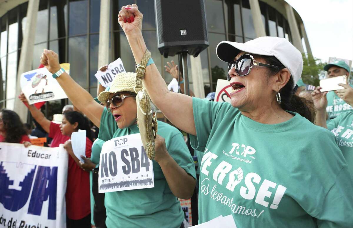 Lydia Baldera, right, and Maria Lira, left, of Houston yell chants as protestors hold a rally in front of the Federal Courthouse in San Antonio, Tx against SB 4 on June 26, 2017.