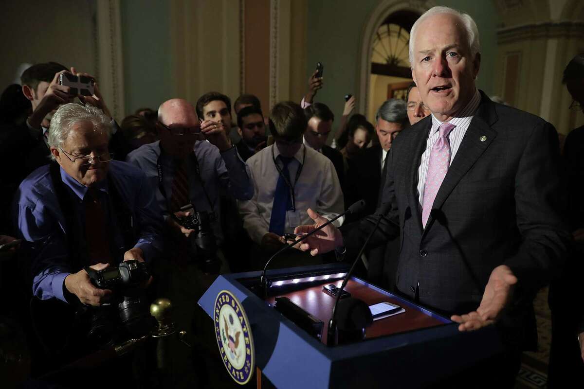 WASHINGTON, DC - JUNE 20: Senate Majority Whip John Cornyn (R-TX) (R) talks to reporters following the weekly GOP policy luncheon at the U.S. Capitol June 20, 2017 in Washington, DC. Cornyn is one of 13 Senate Republicans working behind closed doors to craft new health care legislation they hope will replace the Affordable Care Act, or Obamacare. (Photo by Chip Somodevilla/Getty Images)