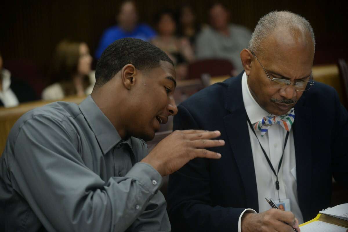 Tyrece Harris consults with his attorney during his trial on Monday. Harris is accused of killing Jimmy Bertrand.