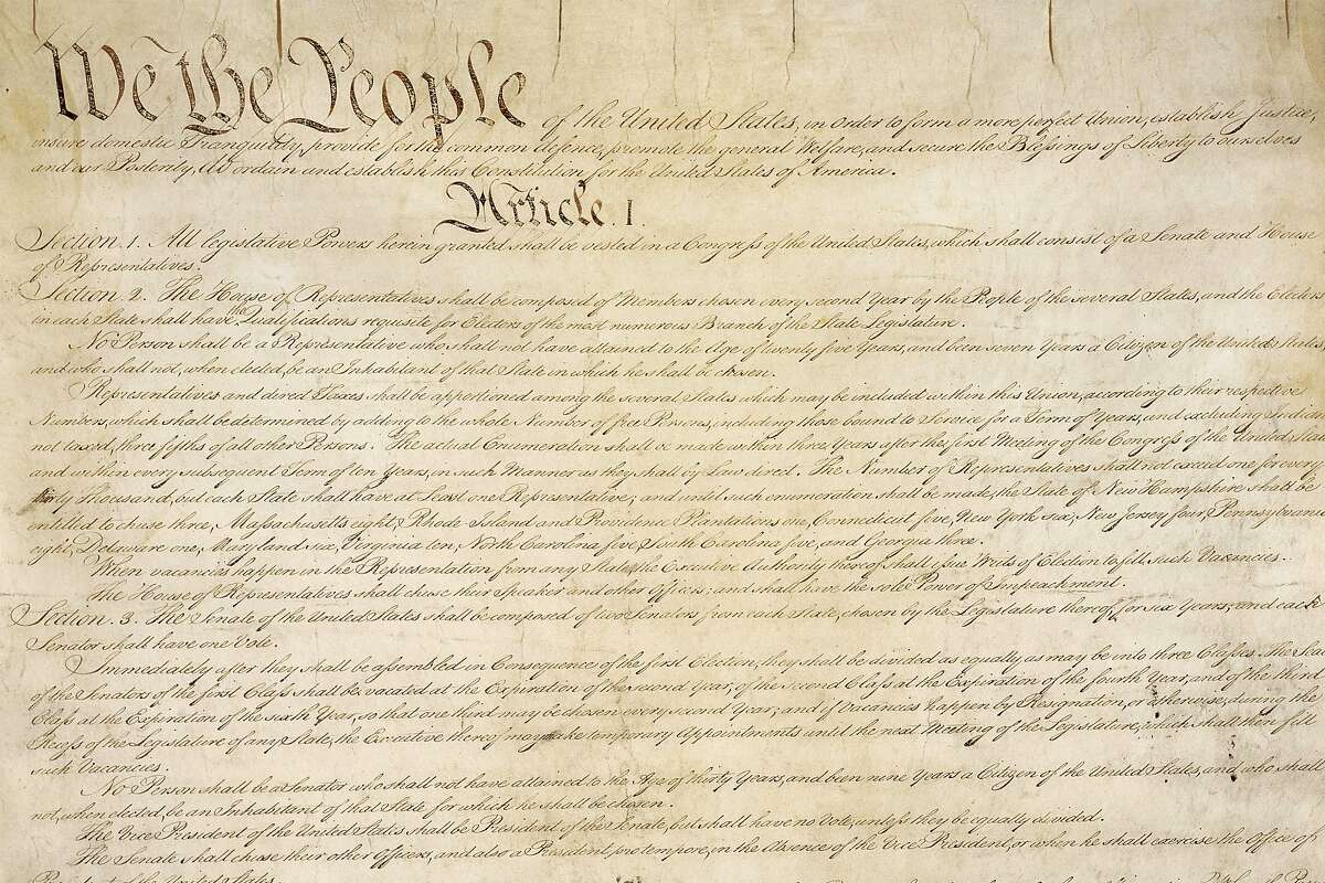 This photo from the U.S. National Archives shows a portion of the first page of the United States Constitution.