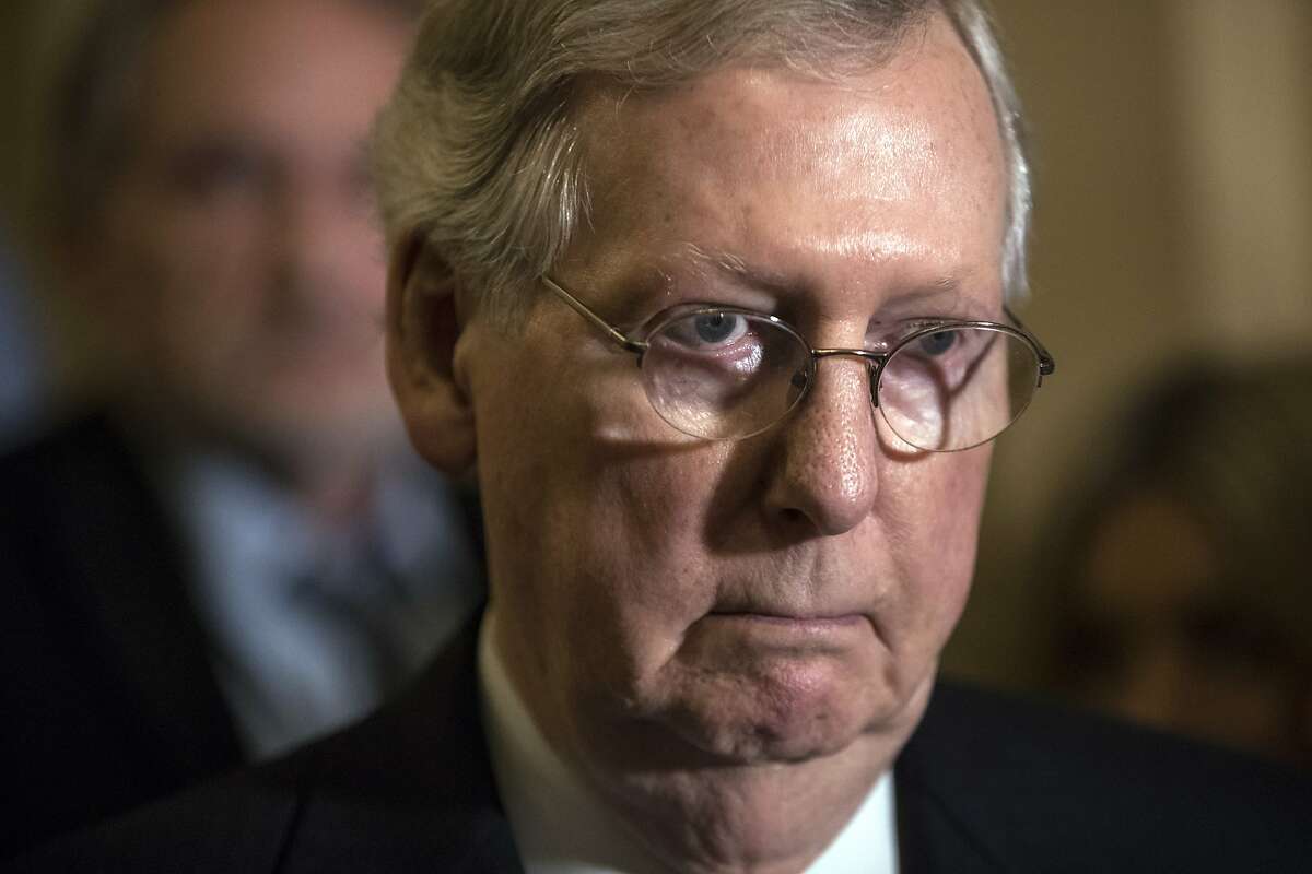 Senate Majority Leader Mitch McConnell, R-Ky., tells reporters he is delaying a vote on the Republican health care bill while GOP leadership works toward getting enough votes, at the Capitol in Washington, Tuesday, June 27, 2017. (AP Photo/J. Scott Applewhite)