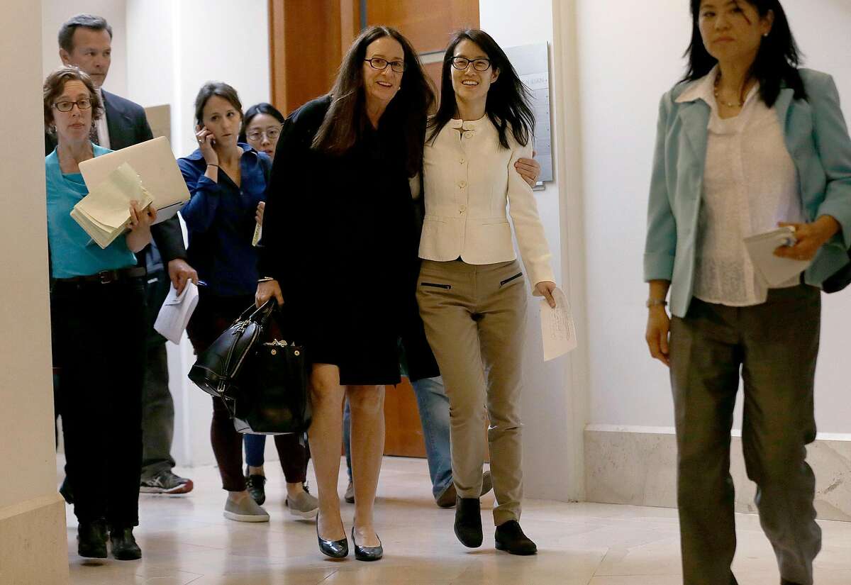 Ellen Pao, center right, walks with her attorney Therese Lawless toward a news conference at Civic Center Courthouse in San Francisco, Friday, March 27, 2015. A jury decided Friday that a prestigious venture capital firm did not discriminate or retaliate against Pao in a case that shined a light on gender imbalance and working conditions for women in Silicon Valley. (AP Photo/Jeff Chiu)