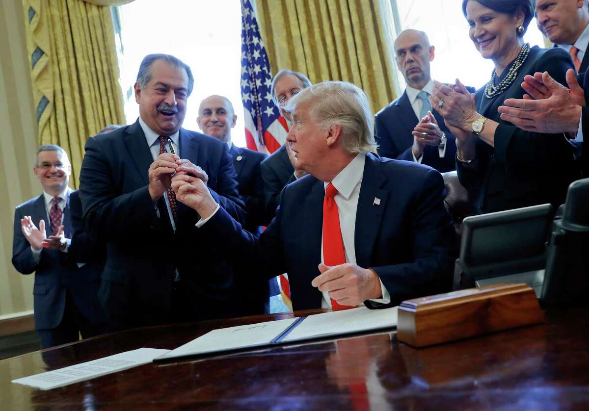 When President Donald Trump signed an executive order in February on the creation of task forces at federal agencies to roll back government regulations, he handed the pen to Dow CEO Andrew Liveris.