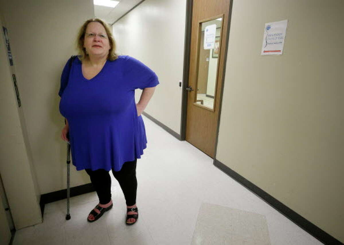 Cherlyn Glanville, a retired Houston ISD French teacher, leaves from a doctor's office Tuesday, June 27, 2017, in Houston. She worries whether she'll be able to afford her medications and doctor visits.