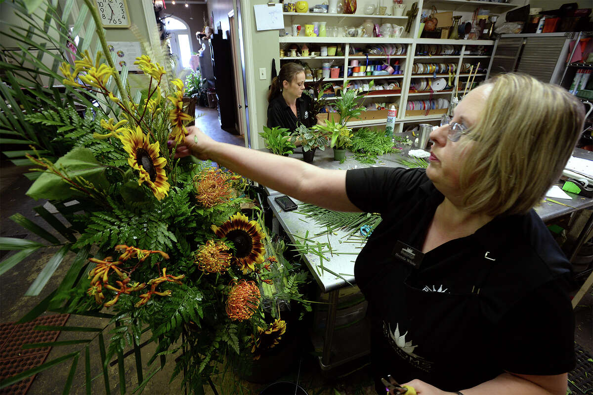Krista Tanner, left, and Brenda White construct funeral arrangements Tuesday at Blooms in Beaumont. Stemming from family requests, making donations instead of flowers has become more common for funeral services. Photo taken Tuesday, June 27, 2017 Guiseppe Barranco/The Enterprise
