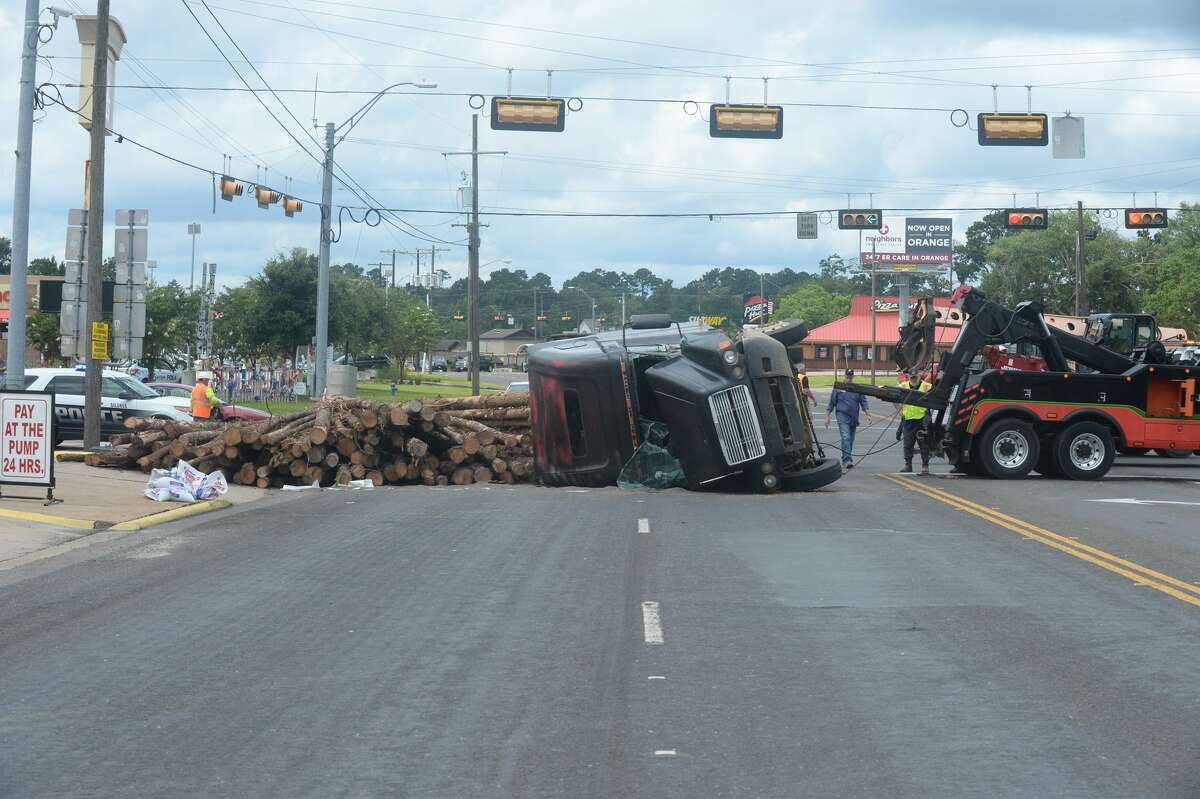 Lumber is in the road at Business 96 and FM 327 in Silsbee after a logging truck overturned Wednesday, June 28, 2017.
