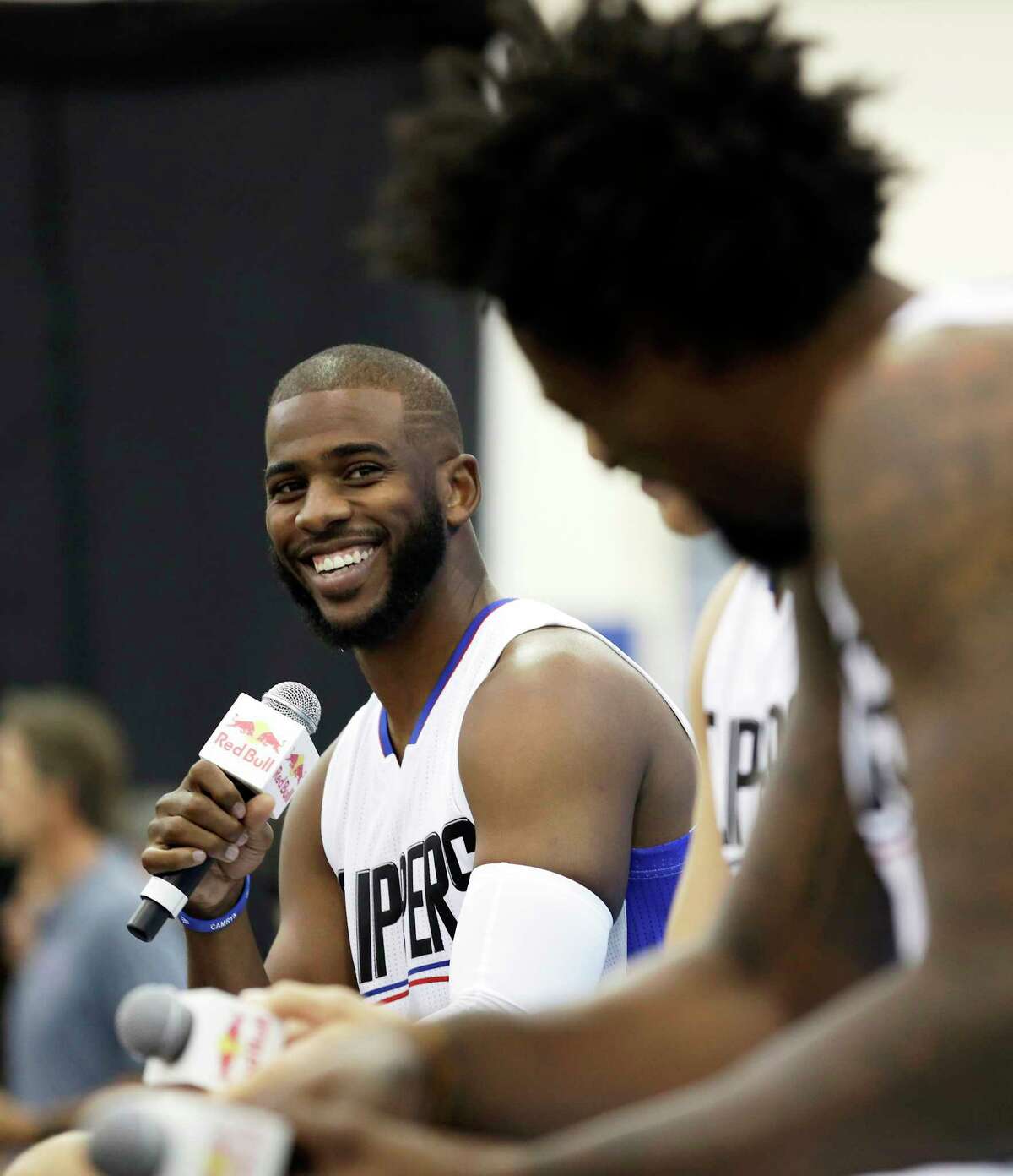 FILE - In this Sept. 26, 2016, file photo, Los Angeles Clippers' Chris Paul laughs as he, Blake Griffin and DeAndre Jordan, right, talk during the team's NBA basketball media day, in Playa Vista, Calif. The Houston Rockets have reached an agreement to trade for Los Angeles Clippers point guard Chris Paul according to a person familiar with the deal. The league source spoke to The Associated Press on Wednesday, June 28, 2017, on the condition of anonymity because the team hasn't finalized the trade.(AP Photo/Ryan Kang, File)