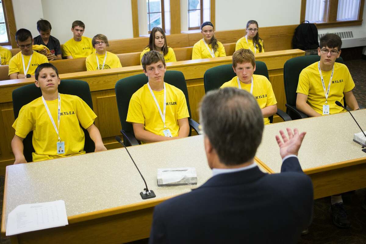 Participants in the Midland Youth Law Enforcement Academy listen to Midland County Prosecuting Attorney J. Dee Brooks on Tuesday, June 27, 2017 at the Midland County Courthouse.
