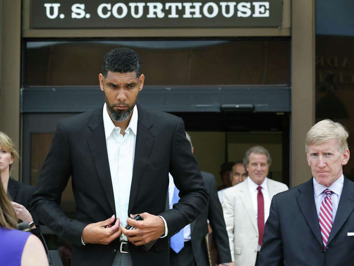 Retired Spurs player Tim Duncan leaves the John H. Wood Jr. Federal Courthouse with his lawyers after the June 2017 sentencing of former financial adviser Charles Banks.