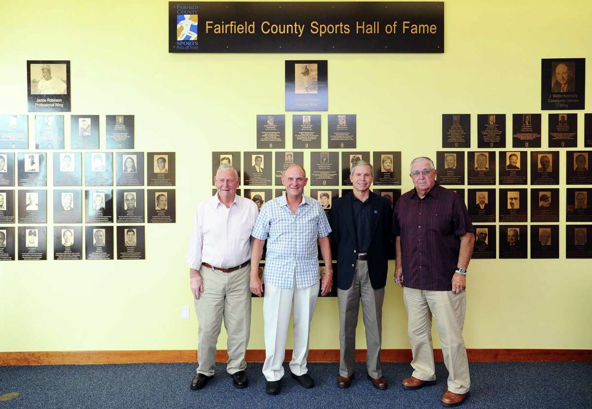 From left, Don LaJolie, Jim Dolan, Laddie Lawrence and John Stratton pose for a photo in front of the Fairfield County Sports Hall of Fame inside UConn Stamford in downtown Stamford, Conn. on Wednesday, June 28, 2017. Dolan and Lawrence are new inductees while LaJolie and Stratton are representing inductees.