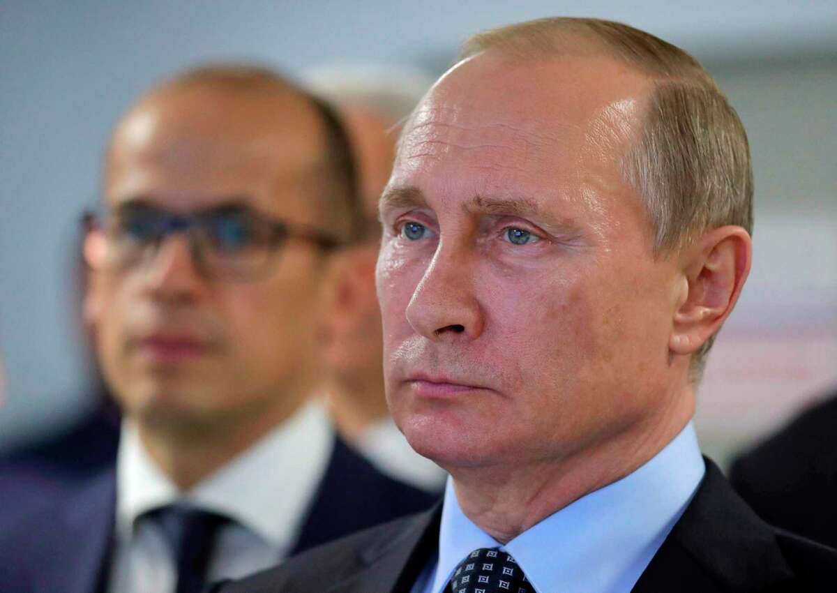 FILE - In this June 27, 2017, file-pool photo, Russian President Vladimir Putin is seen in Izhevsk, Russia. Kremlin leaders are convinced America is intent on regime change in Russia, a fear that is feeding rising tension and military competition between the former Cold War foes, the PentagonÂ?’s intelligence arm says in a new assessment. (Mikhail Klimentyev/Pool Photo via AP, File)