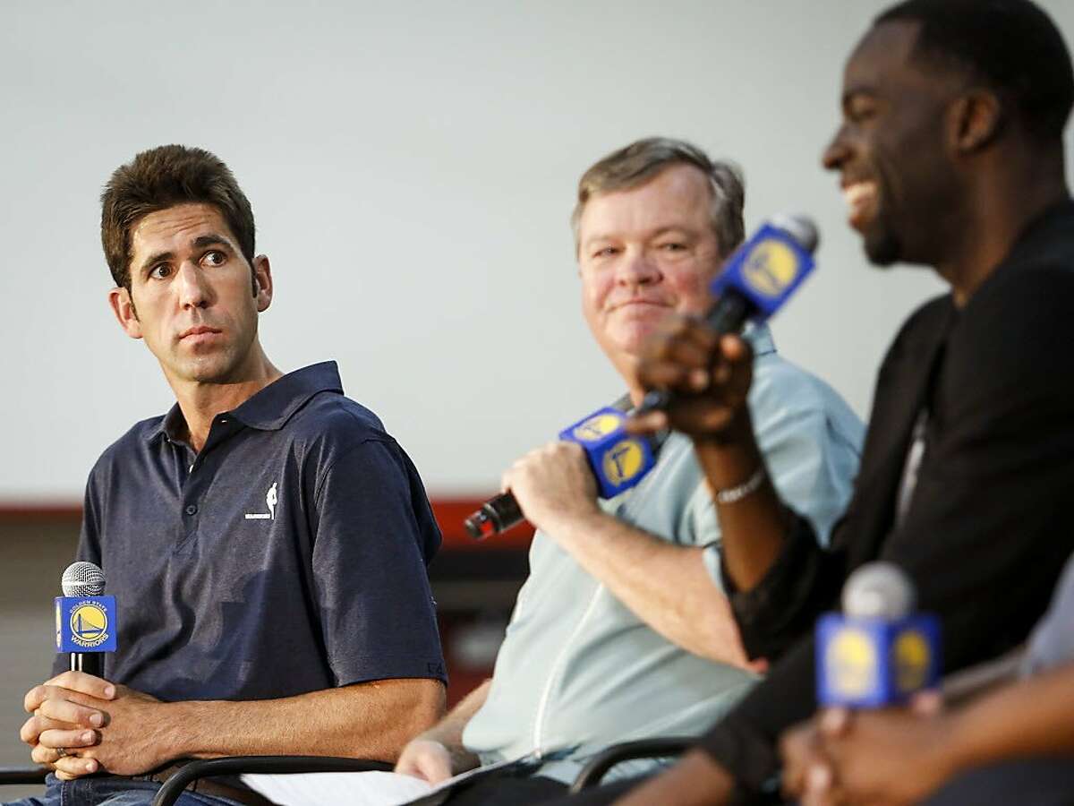 Bob Myers, general manger of the Golden State Warriors, listens to Draymond Green speak during a news conference in the gym of Monte Vista High School, Myer's alma mater, in Danville on Wednesday, June 28, 2017. Monday Draymond Green was announced Defensive Player of the Year and Bob Myers was announced the Executive of the Year by the NBA.