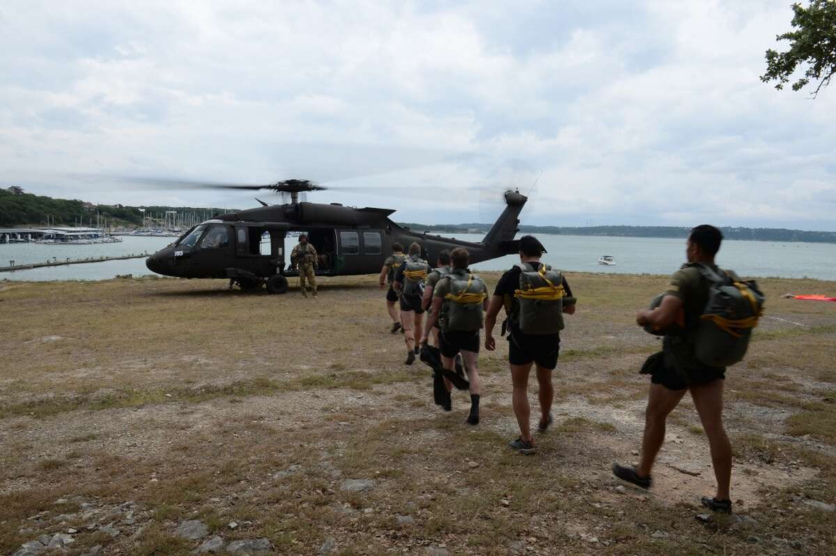 Texas Guardsmen drop from helicopter into Canyon Lake at 1,500 feet. 