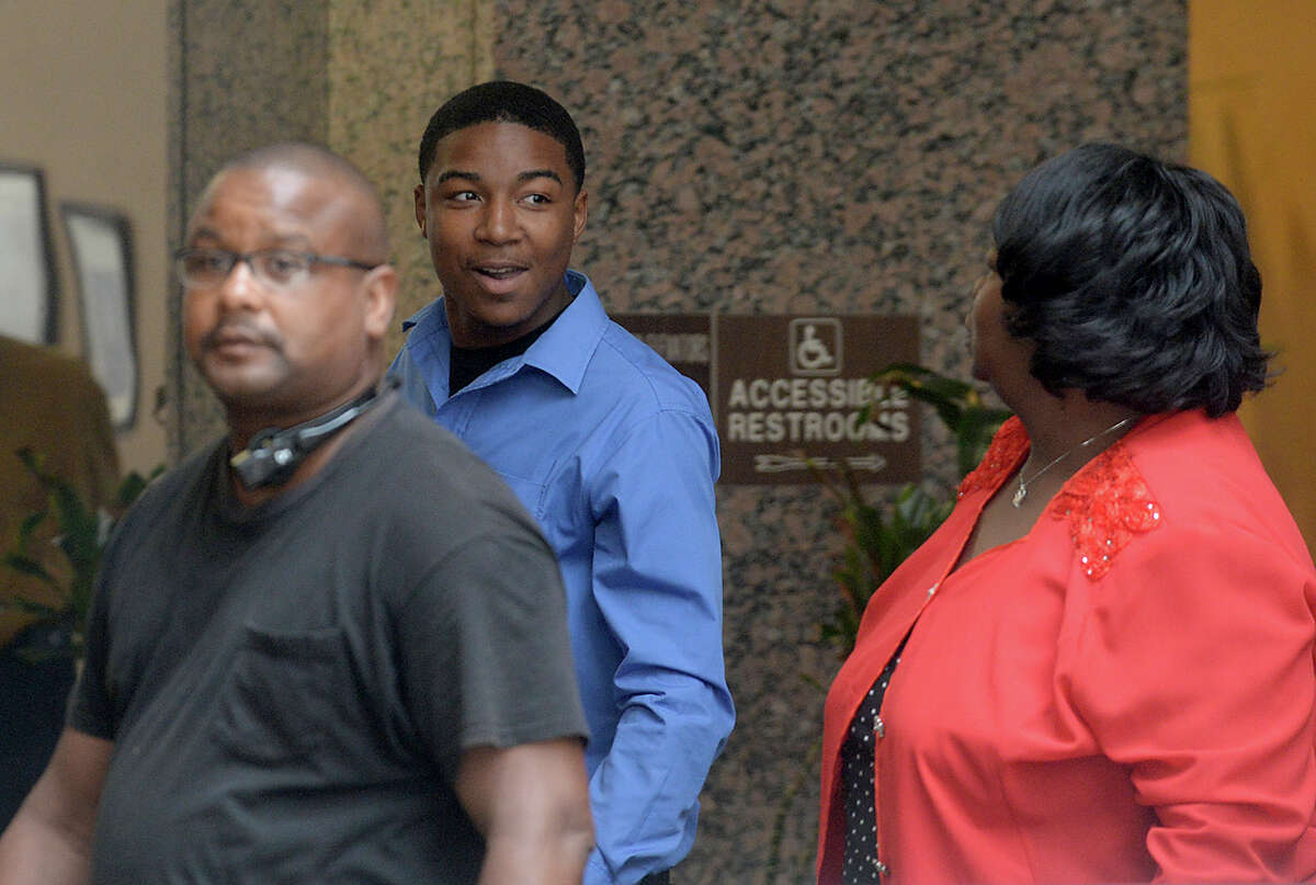 Tyrece D'Andre Harris talks with family as they make their way back into Judge John R. Stevens' courtroom for the continuation of his trial Wednesday. Harris is accused of the shooting death of West End resident Jimmy Bertrand and pled not guilty Tuesday. Photo taken Wednesday, June 28, 2017 Kim Brent/The Enterprise